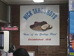 Sign: "Nick Tahou Hots," "Home of the Garbage Plate," "Established 1918." Garbage Plate is illustrates with steaming hots, baked beans, bread and butter.