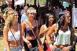 Image 137Women in Oregon wearing festival fashion including lace tops, maxi skirts, flower crowns, and stacked bracelets, 2013. (from 2010s in fashion)