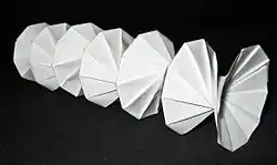 Mathematical origami: Spring Into Action, by Jeff Beynon, made from a single paper rectangle.[196]