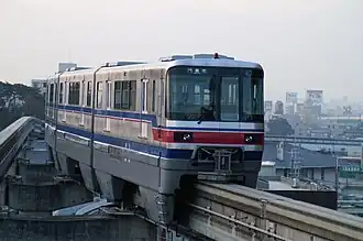 Osaka Monorail 1000 series train at Hotarugaike Station