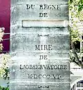 The inscription on the stone marking the Paris Meridian, made in 1806, and originally placed in the garden of the Paris Observatory. The name of the Emperor Napoleon was erased from the monument after the Restoration of the Monarchy.