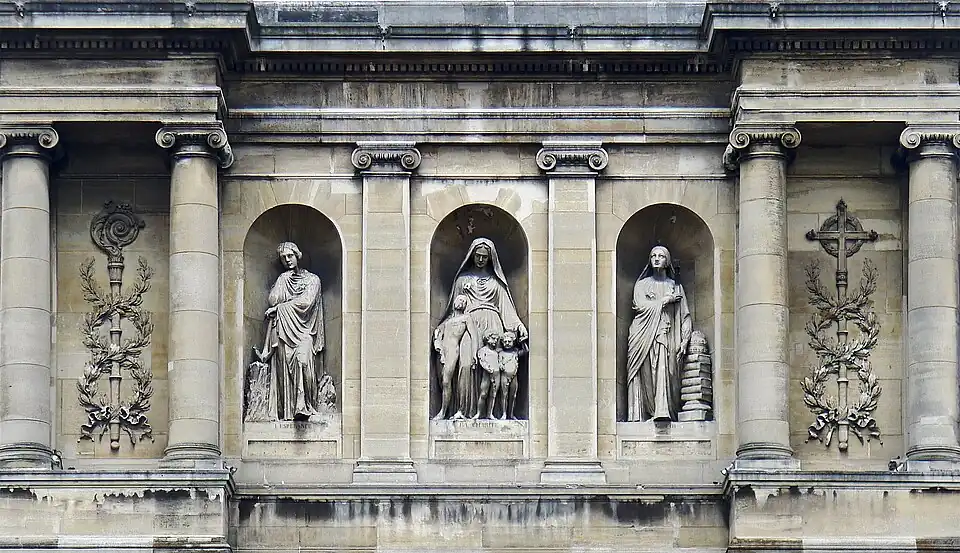 Sculpture on the facade: "Faith", "Hope" and "Charity".