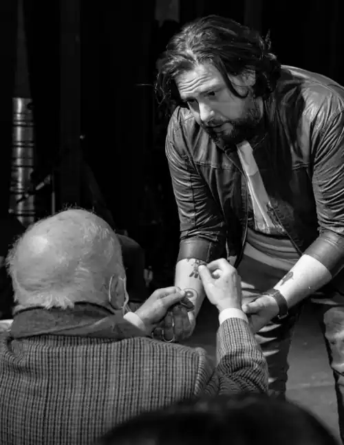 Pablo Daniel Magee onstage, being saluted by Maestro Jose Luis Ardissone after a play.