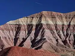 The gray and red colored bands across the landform are typical of most geologic features in the Painted Desert.