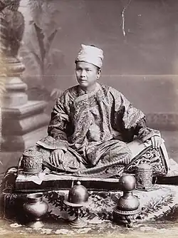 A Shan chief, sitting on a cushion