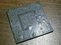 A ball-grid array component displaying the "popcorn effect"