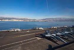 View of coast and port from a ship at anchor