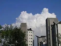 Cloud behind two apartments