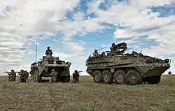 BABADAG TRAINING AREA, Romania - U.S. Soldiers of the 2nd Stryker Cavalry Regiment and Romanian forces of the 33rd Mountain Troop Battalion, Posada train together during the 2009 JTF-East rotation at the Babadag Training Area, Romania.