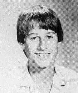 Black-and-white head shot of a young Goldman smiling