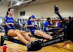 Several indoor rowers