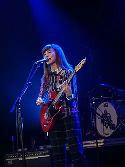 Rina performing in 2015