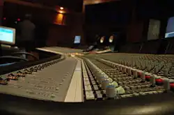 A recording console inside a studio.