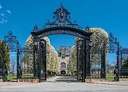 Salve Regina University's gates frame the building's driveway