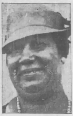 Sarah Todd Cunningham wearing a hat and looking at the camera