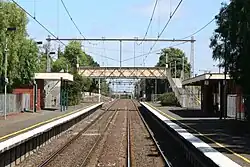 South-west view of platforms, station buildings and pedestrian bridge, March 2007