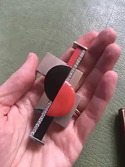 Semaphore brooch by Gerard Sandoz, in platinum, coral, onyx, diamonds, 1925