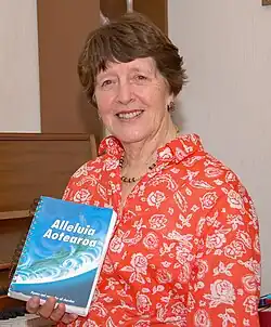 Shirley Murray holding a hymnbook