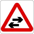 Two-way traffic crosses a one-way road