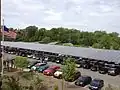 Solar panel canopies over parking lots