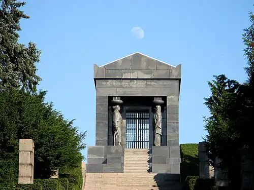 Art Deco caryatids of the Monument to the Unknown Hero, atop Mount Avala, south-east of Belgrade, Serbia, wirhcaryatids representing all the peoples of the Kingdom of Yugoslavia, by Ivan Meštrović, 1934–1938[31]