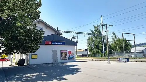 Two-story building with gabled roof