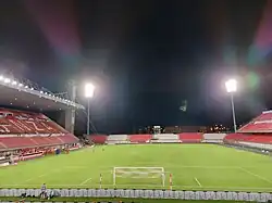 The Brianteo stadium during the nighttime, with the grandstand on the left