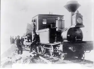 Macquarie Harbour breakwater construction, Tasmania. Ex Queensland railways locomotive.