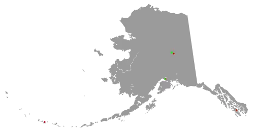 Oultine of map of Alaska with colored dots representing the location of Superfund sites in the state