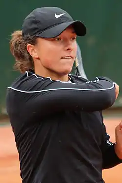 Iga Świątek, the 2025 ladies' singles champion.