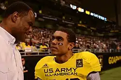 David Robinson, retired from the Spurs, speaks with his son, Corey Robinson, wide receiver for the West team, at the U.S. Army All-American Bowl at the Alamodome in San Antonio on Jan. 5, 2013.