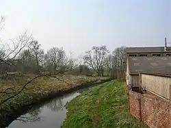 River Foss in Strensall as seen from the Post Office, 54°02′27″N 1°02′07″W﻿ / ﻿54.040923; -1.035334