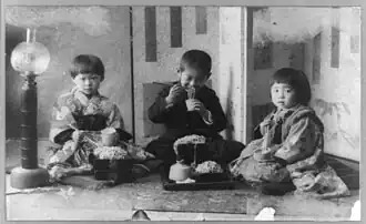 Three children eating soba, 1890–1923