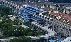 An aerial view of the USJ 7 station, with the BRT Sunway Line guideway making a loop with a stop beneath the station