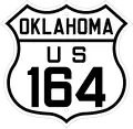 A U.S. route shield in the 1926 style, reading "OKLAHOMA / US / 164".