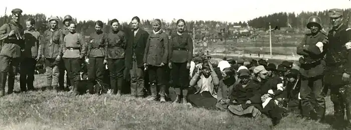 Panoramic photo of captured women and guards