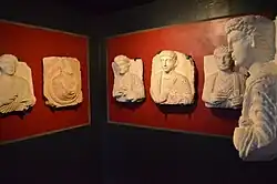 Sculpted headstones in a museum