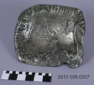 Metal World's Fair (1904) tray with image of Prophet on throne, building, and female personification at left