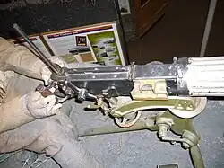 View of the breech of a Vickers gun showing brass feed ramp.