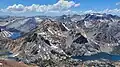 Epidote Peak is black feature in lower left. View from Dunderberg Peak looking west. Summit Lake to left, Hoover Lakes lower left, East Lake lower right. Camiaca Peak (reddish) left of center, Gabbro Peak lower right, Twin Peaks upper right.