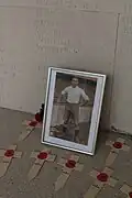 Walter Tull's name on the Arras Memorial and left memorabilia