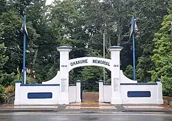 photo of large concrete memorial gate with arch.