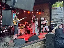 The band performing onstage