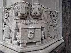 Stone carvings of lions that guard the door