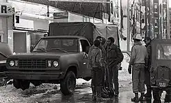 National Guardsmen work with local workers and volunteers in Boston