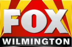 The Fox logo in white atop a field of red flanked by yellow searchlights. Beneath is a black bar with the word "WILMINGTON" in a bold sans serif in white.