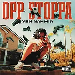 A man is crouching and making handgun gestures, with several glocks floating around him. The artist's name and song title appear above him, colored in black and red respectively.