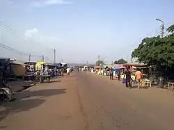 View of main street in Yeji. In the background is Lake Volta.