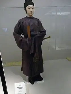 Men's dress, with kanmuri hat, hakama, ornate sash, shaku and sword