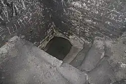 Вход в подземный колодец